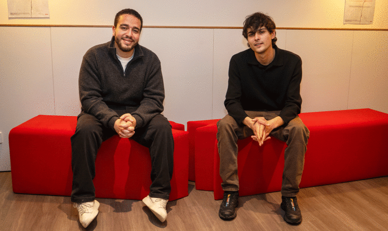 The two Product Design students from IED Barcelona who designed the bench sitting on it.