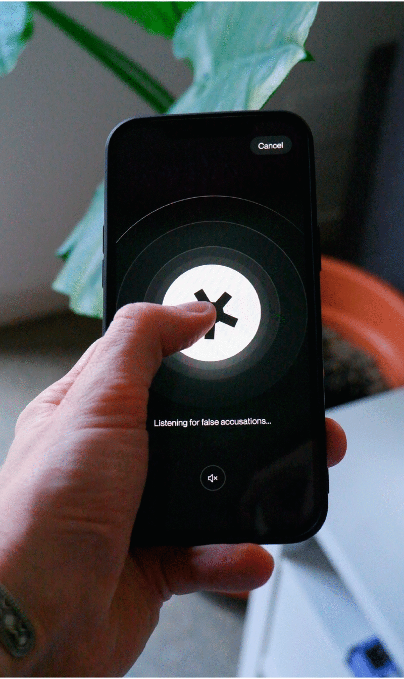 A person holding a mobile phone with the YapTrap app running